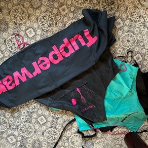 3 Tupperware aprons and one tablecloth. Never used, been in storage.